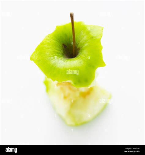 An Apple Core Isolated On A White Background Shot With Shallow Focus