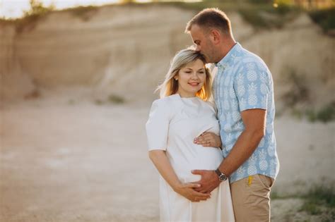 Premium Photo Pregnant Woman With Her Husband In Sand Quarry