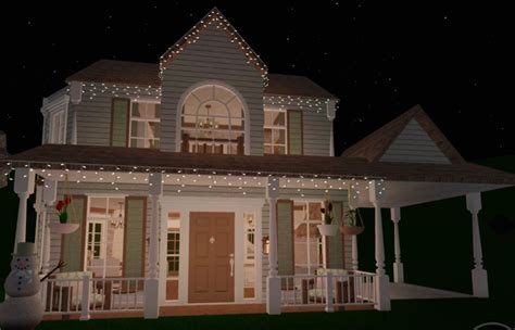 An Animated House With Christmas Lights On The Porch And Front Door Is