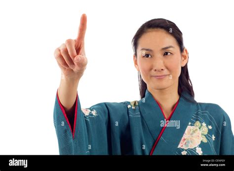 Japanese Woman In Kimono Pointing Her Finger On Imaginery Virtual Button Isolated Over White