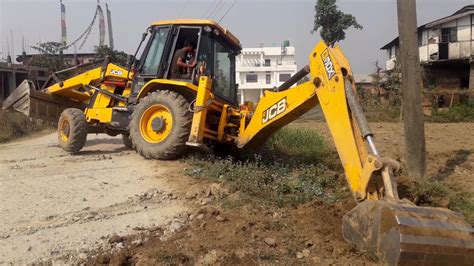 JCB Backhoe Loader Making Drain In Village Road Droneplanet2040 YouTube