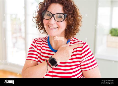 Beautiful Senior Woman Wearing Glasses And Casual T Shirt Cheerful With