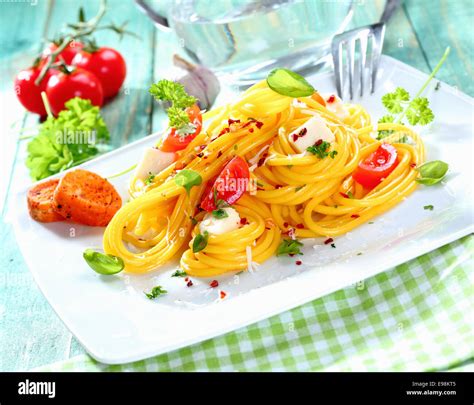 Plate Of Fresh Spaghetti Caprese With Mozarella Cheese Tomatoes And