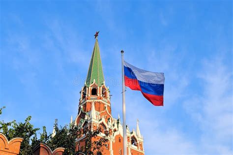 Flag Of Russia Against Troitskaya Tower Of The Moscow Kremlin Stock