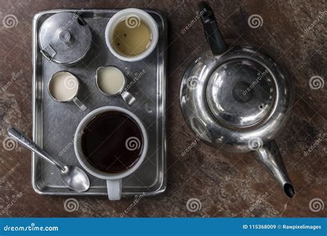 Two Asian Coffee Waitress Making Cup Of Hot Coffee Latte In Coffee Shop