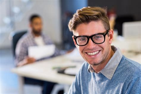 Premium Photo | Smiling businessman in office