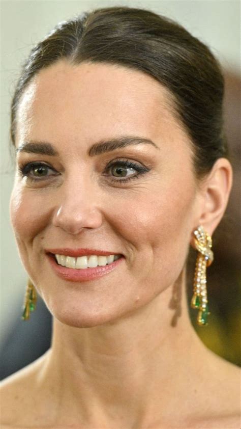 A Close Up Of A Person Wearing Earrings