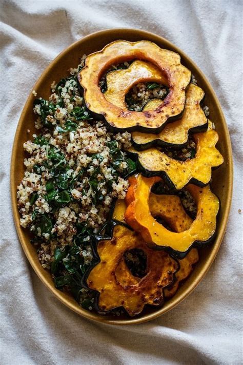 A Bowl Filled With Different Types Of Food On Top Of A White Table