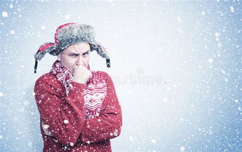 Frozen Man In Sweater Scarf And Hat Warming Hands Cold Snow