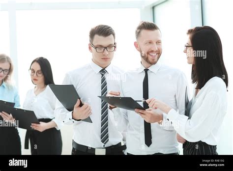 Employees Discussing Business Documents In The Office Stock Photo Alamy