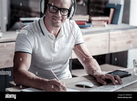 Smart Mature Guy Smiling While Working On Computer Stock Photo Alamy