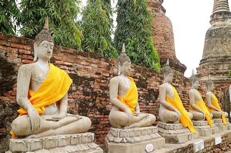 Premium Photo Row Of Buddha Images With Group Of Stupas Wat Yai Chai