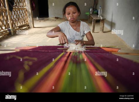A Tribal Woman Weaving Rignawi A Traditional Cloth Used By The