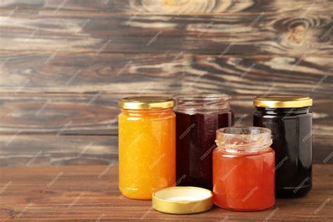 Premium Photo Assortment Of Jams On Brown Background With Copy Space