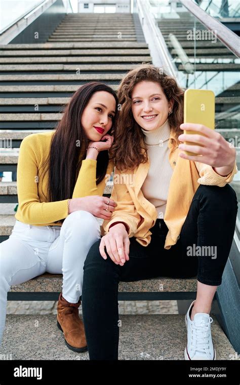 Two Friends Smartphone Stair Hi Res Stock Photography And Images Alamy