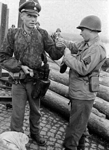 Black And White Photograph Of Two Men In Uniforms Shaking Hands With