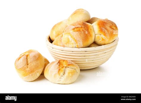 Bunch Of Whole Fresh Baked Wheat Buns In Baking Basket On White