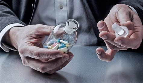 Businessman Opening A Jar Full Of Pills Martin Duquette Pharmacy