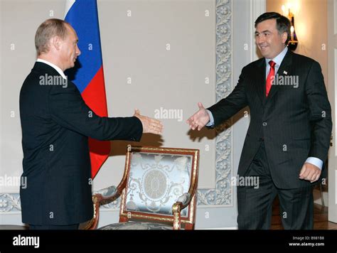 Russian President Vladimir Putin left and Georgian President Mikheil ...