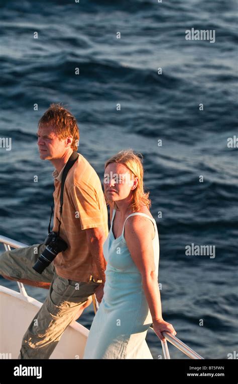 Couple On Deck Of A Cruise Ship Boat At Port Egas James Bay Isla