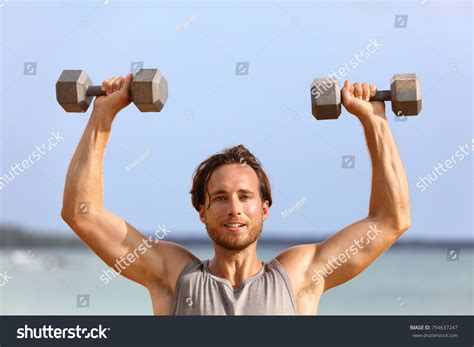 Fitness Gym Man Lifting Dumbbell Weights Stock Photo 794637247