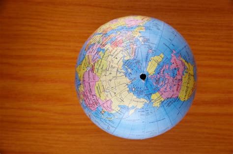 premium photo top view  globe  wooden table