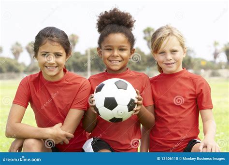 Young Girls in Football Team Stock Photo - Image of together, holding: 12406110