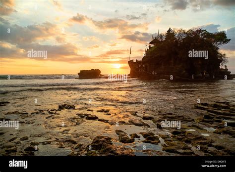 Sunset at tanah Lot temple Stock Photo - Alamy