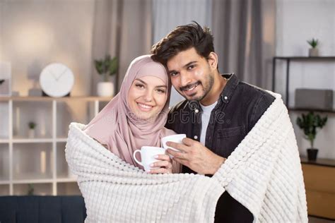 Romantic Relationship Cute Arabian Muslim Couple Standing Together Under Warm Blanket In The