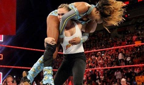 Former UFC Women’s Champion Ronda Rousey Makes WWE Raw Debut, Almost Rips Opponent’s Arm Off ...