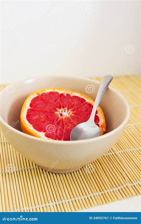 Pink Grapefruit In A Bowl With Spoon Stock Image Image Of Grapefruit