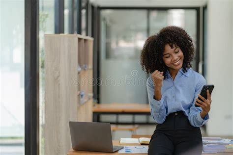 African American Businesswoman Working On Laptop At Office Using