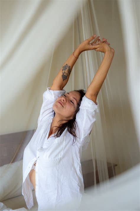 Woman Waking Up Stretching Arms On The Bed In The Morning Stock Image Image Of Happiness