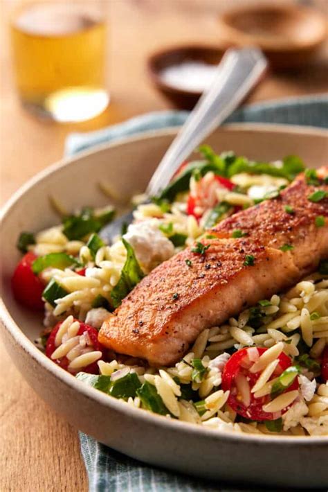 Pan Seared Salmon With Orzo Salad Garnish With Lemon