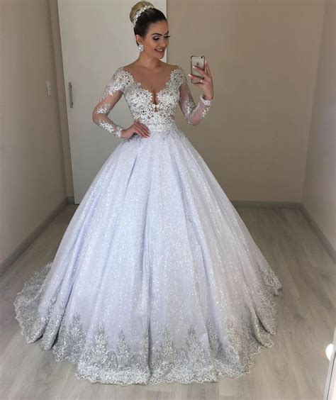 A Woman Is Taking A Selfie In Her Wedding Dress While Holding A Cell Phone