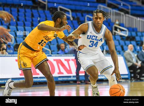 Ucla Bruins Guard David Singleton 34 Dribbles The Ball Away From Long