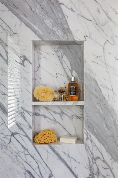 Stacked Gray Marble Tiled Shower Niches Are Framed By A Gray Marble