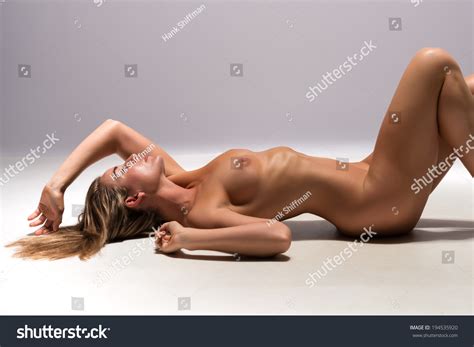 Beautiful Sunburned Brunette Nude On Gray Stock Photo 194535920 Shutterstock