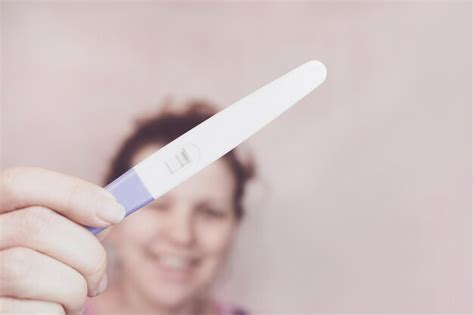 Premium Photo Close Up Of Woman Hand Holding Pregnancy Test