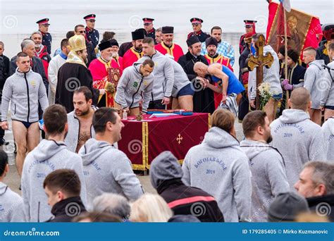 Orthodox Christians Swimming For The Holy Cross In The Icy Cold Water