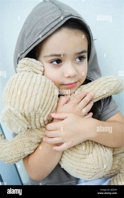 Little Girl Holding Teddy Bear Portrait Stock Photo Alamy