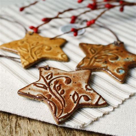 Three Star Shaped Cookies Sitting On Top Of A Table