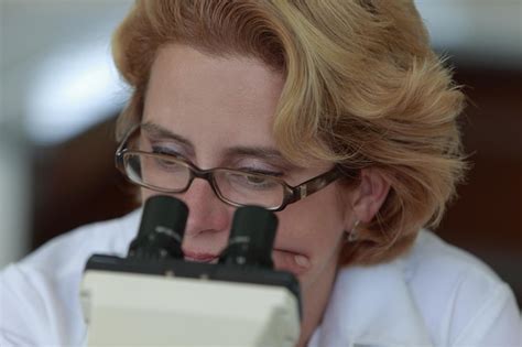 Premium Photo Close Up Of Woman Looking Through Microscope In Laboratory