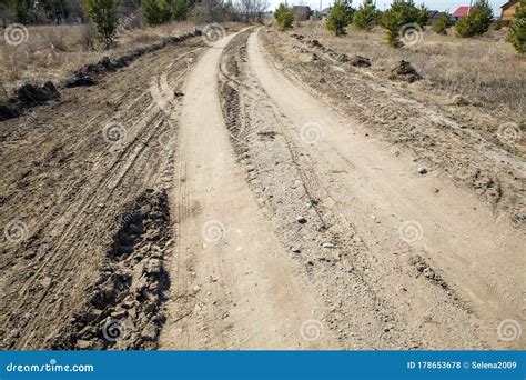 Grader Rural Road Leading To The Village Dirt Mud And Dusty Road