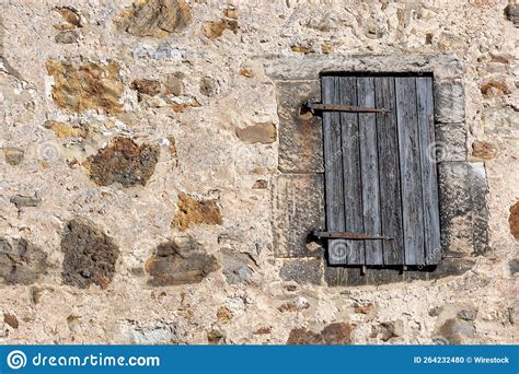 Antique Wooden Door With Iron Hinges At The Entrance Of A Sacred Place