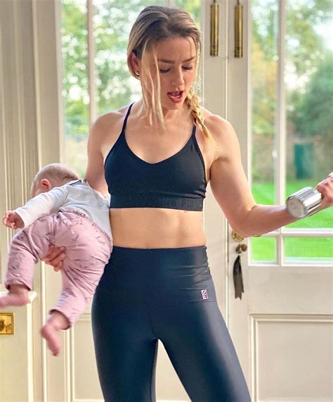 Amber Heard Works Out While Holding 5-Month-Old Baby Oonagh Paige