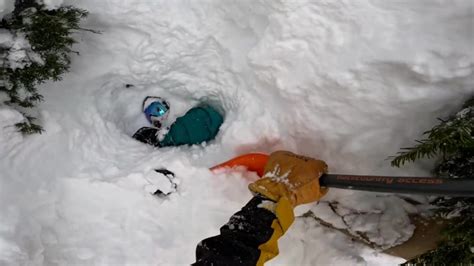 Moment Snowboarder Buried In Avalanche Is Rescued In Dramatic Bodycam