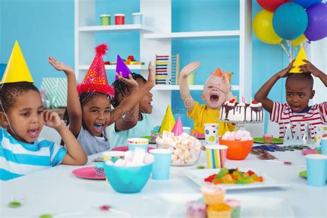 Excited Kids Enjoying a Birthday Party Stock Photo - Image of male ...