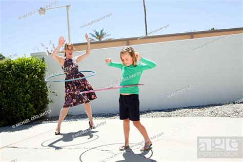 Mother And Daughter With Hoola Hoops Stock Photo Picture And Royalty