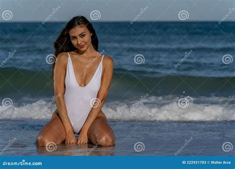 Lovely Mixed Race Bikini Model Posing Outdoors On A Caribbean Beach